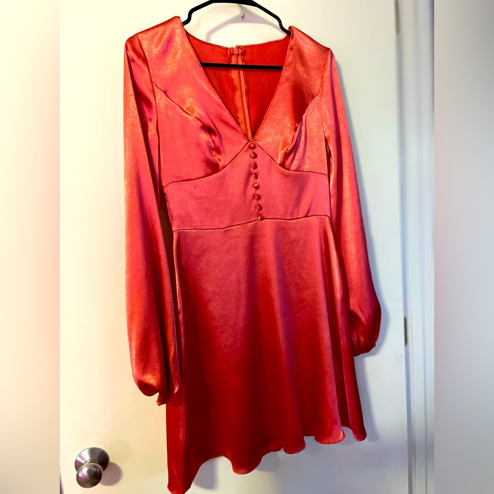 David’s Bridal size four. Has some minor picks on it.